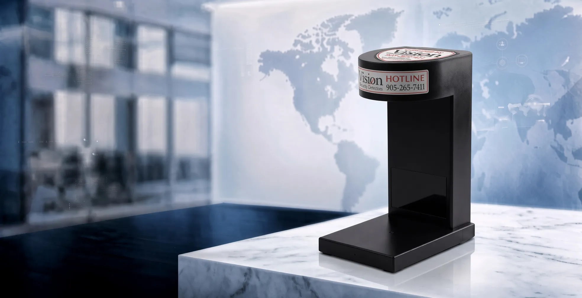 The Vision MCD-900-1 counterfeit detector on a marble counter, a world map behind it